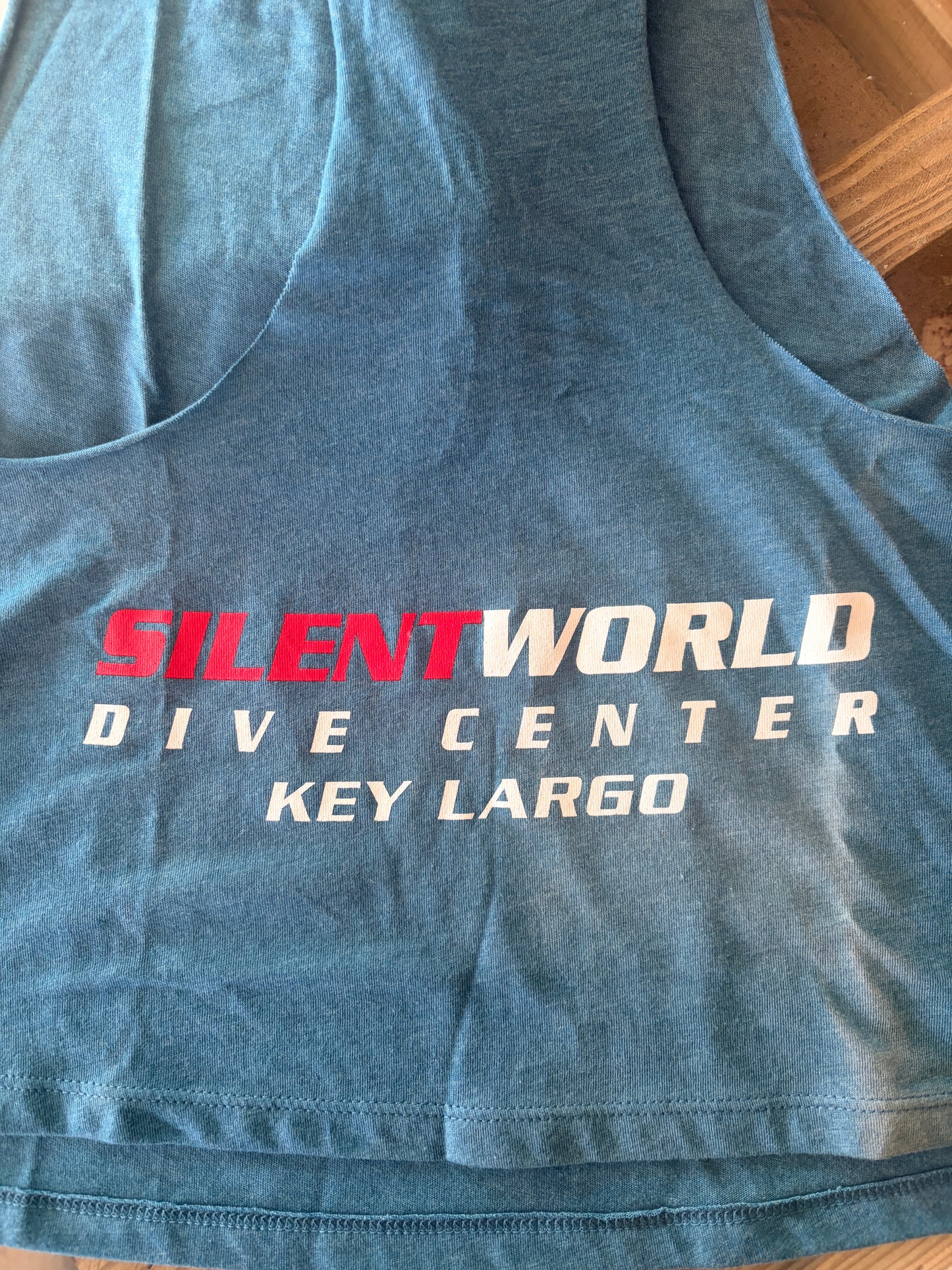 Women's Racerback Crop Tank with Silent World Dive Center Graphic